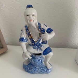 Blue and white porcelain fisherman figure